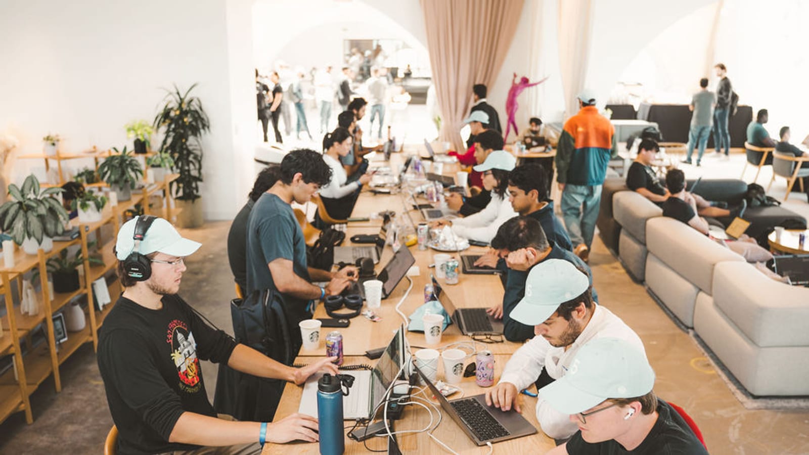 Hackathon participants building together in a shared workspace